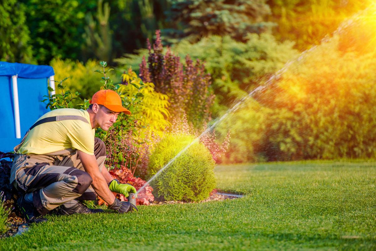 a technician performing a Lawn Sprinkler Repair, Sprinkler System Installation, Lawn Sprinkler System, and More in Broomfield, Colorado